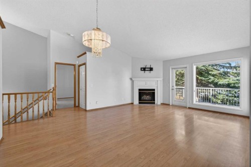 35 Douglasview Park Se, Calgary, AB - Indoor Photo Showing Living Room With Fireplace