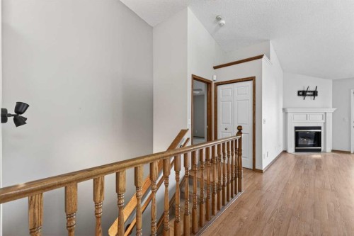 35 Douglasview Park Se, Calgary, AB - Indoor Photo Showing Other Room With Fireplace