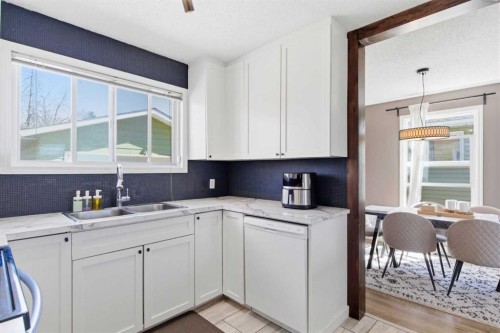 14767 Deer Ridge Drive Se, Calgary, AB - Indoor Photo Showing Kitchen With Double Sink