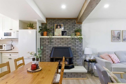 14767 Deer Ridge Drive Se, Calgary, AB - Indoor Photo Showing Dining Room With Fireplace