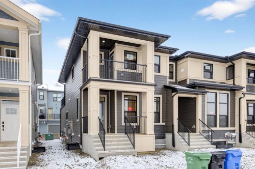 338 Alpine Boulevard Sw, Calgary, AB - Outdoor With Balcony With Facade