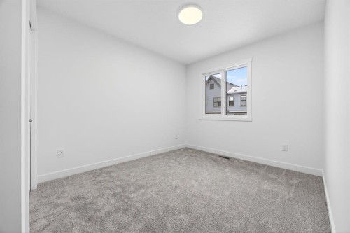 338 Alpine Boulevard Sw, Calgary, AB - Indoor Photo Showing Other Room