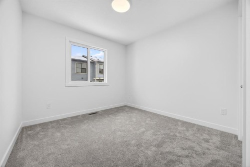 338 Alpine Boulevard Sw, Calgary, AB - Indoor Photo Showing Other Room