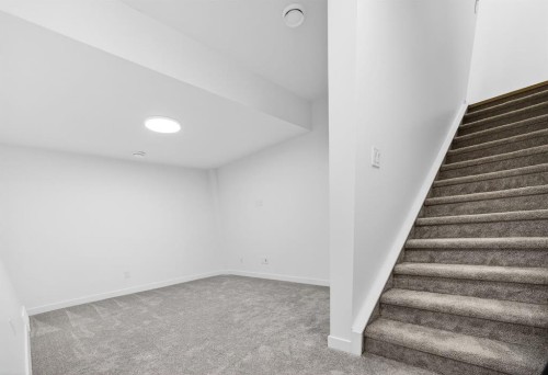 338 Alpine Boulevard Sw, Calgary, AB - Indoor Photo Showing Other Room