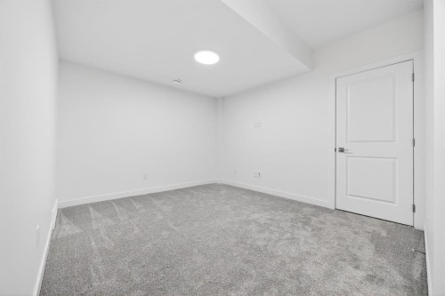 338 Alpine Boulevard Sw, Calgary, AB - Indoor Photo Showing Other Room