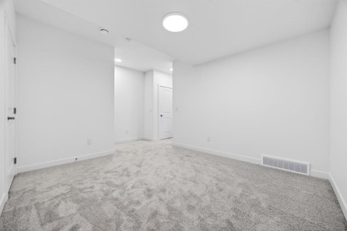 338 Alpine Boulevard Sw, Calgary, AB - Indoor Photo Showing Other Room