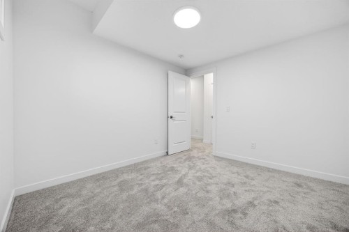 338 Alpine Boulevard Sw, Calgary, AB - Indoor Photo Showing Other Room