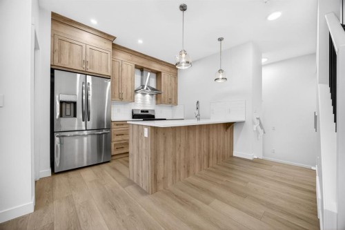 338 Alpine Boulevard Sw, Calgary, AB - Indoor Photo Showing Kitchen With Stainless Steel Kitchen With Upgraded Kitchen