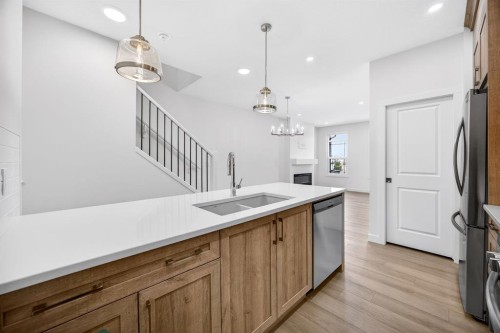 338 Alpine Boulevard Sw, Calgary, AB - Indoor Photo Showing Kitchen With Double Sink