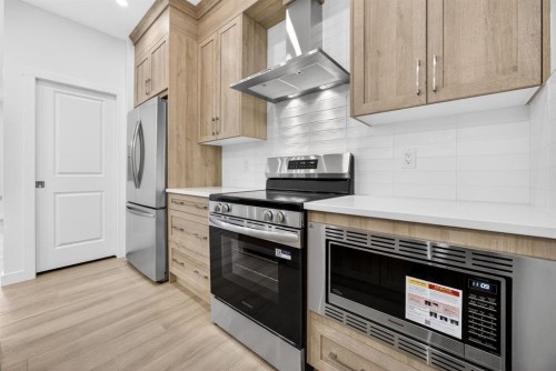 338 Alpine Boulevard Sw, Calgary, AB - Indoor Photo Showing Kitchen With Stainless Steel Kitchen