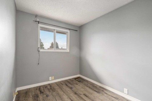 19 Bernard Drive Nw, Calgary, AB - Indoor Photo Showing Other Room