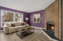 19 Bernard Drive Nw, Calgary, AB  - Indoor Photo Showing Living Room With Fireplace 