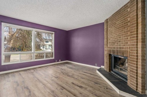 19 Bernard Drive Nw, Calgary, AB - Indoor With Fireplace