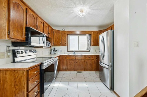 156 Falshire Close Ne, Calgary, AB - Indoor Photo Showing Kitchen