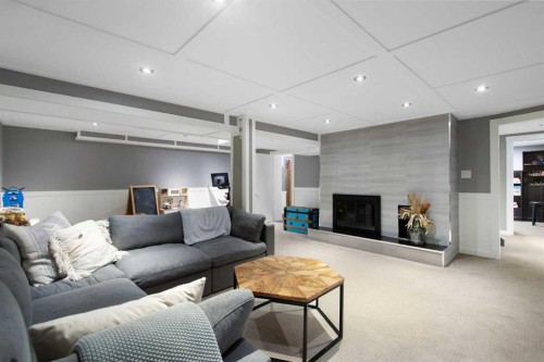 9828 Avalon Road Se, Calgary, AB - Indoor Photo Showing Living Room With Fireplace