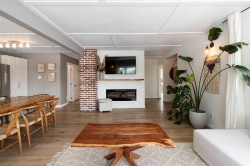 9828 Avalon Road Se, Calgary, AB - Indoor Photo Showing Living Room With Fireplace