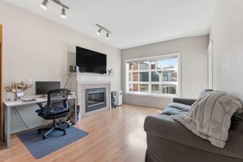 417-333 Riverfront Avenue Se, Calgary, AB - Indoor Photo Showing Living Room With Fireplace