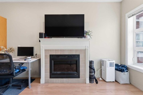 417-333 Riverfront Avenue Se, Calgary, AB - Indoor Photo Showing Living Room With Fireplace