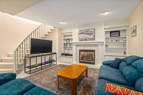 28 Hamptons Rise Nw, Calgary, AB - Indoor Photo Showing Living Room With Fireplace
