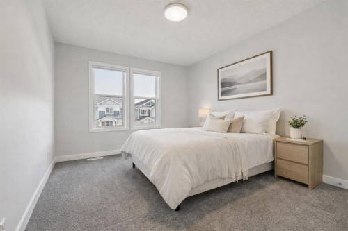 55 Sundown Crescent, Cochrane, AB - Indoor Photo Showing Bedroom