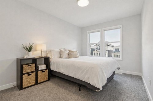 55 Sundown Crescent, Cochrane, AB - Indoor Photo Showing Bedroom