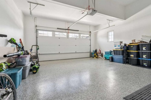 55 Sundown Crescent, Cochrane, AB - Indoor Photo Showing Garage