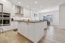 55 Sundown Crescent, Cochrane, AB  - Indoor Photo Showing Kitchen With Upgraded Kitchen 