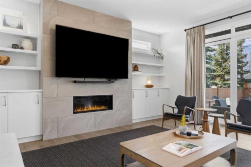 5927 34 Street Sw, Calgary, AB - Indoor Photo Showing Living Room With Fireplace