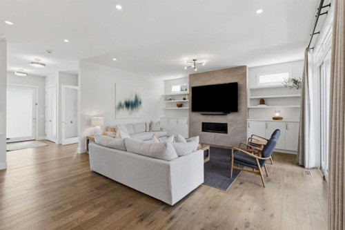 5927 34 Street Sw, Calgary, AB - Indoor Photo Showing Living Room With Fireplace