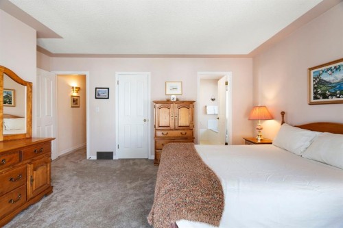 118 Shawnee Place Sw, Calgary, AB - Indoor Photo Showing Bedroom