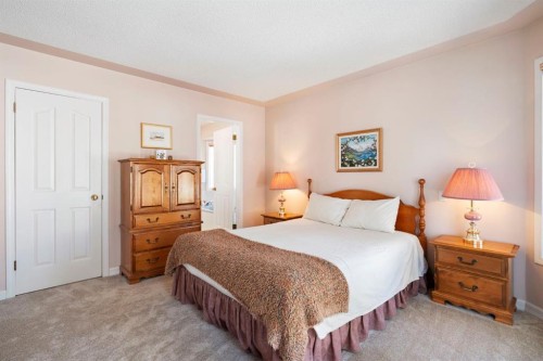 118 Shawnee Place Sw, Calgary, AB - Indoor Photo Showing Bedroom