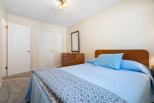 118 Shawnee Place Sw, Calgary, AB - Indoor Photo Showing Bedroom