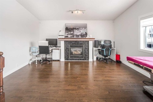 125 Coventry Crescent Ne, Calgary, AB - Indoor Photo Showing Living Room With Fireplace
