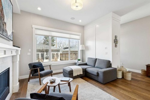646 24 Avenue Nw, Calgary, AB - Indoor Photo Showing Living Room With Fireplace