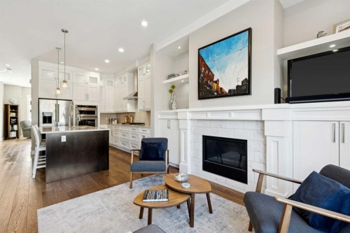 646 24 Avenue Nw, Calgary, AB - Indoor Photo Showing Living Room With Fireplace
