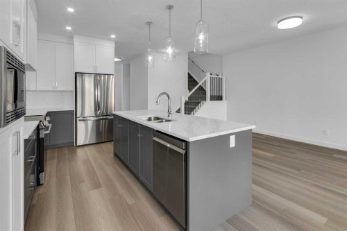 137 Copperhead Road Se, Calgary, AB - Indoor Photo Showing Kitchen With Double Sink With Upgraded Kitchen