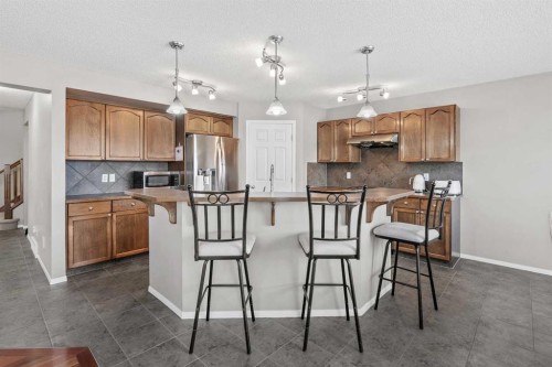 8 Chapalina Rise Se, Calgary, AB - Indoor Photo Showing Kitchen