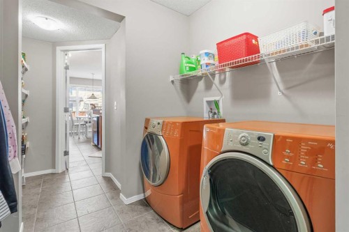 8 Chapalina Rise Se, Calgary, AB - Indoor Photo Showing Laundry Room