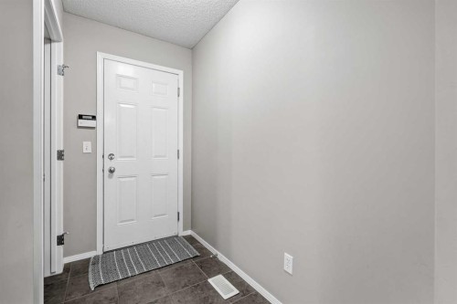 8 Chapalina Rise Se, Calgary, AB - Indoor Photo Showing Other Room