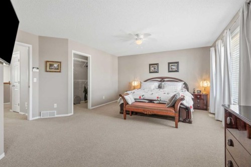 8 Chapalina Rise Se, Calgary, AB - Indoor Photo Showing Bedroom