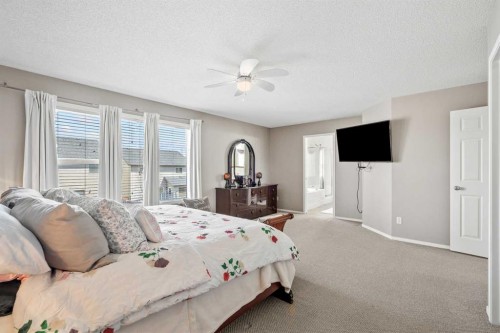 8 Chapalina Rise Se, Calgary, AB - Indoor Photo Showing Bedroom