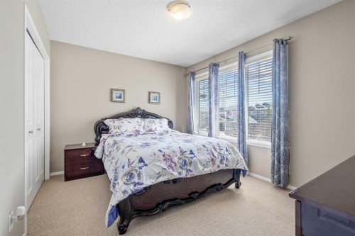 8 Chapalina Rise Se, Calgary, AB - Indoor Photo Showing Bedroom