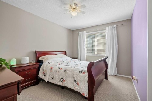 8 Chapalina Rise Se, Calgary, AB - Indoor Photo Showing Bedroom