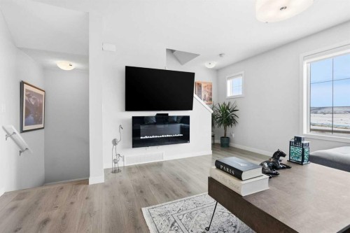 2202-250 Fireside View, Cochrane, AB - Indoor Photo Showing Living Room With Fireplace