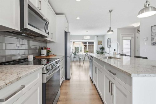 2202-250 Fireside View, Cochrane, AB - Indoor Photo Showing Kitchen With Upgraded Kitchen