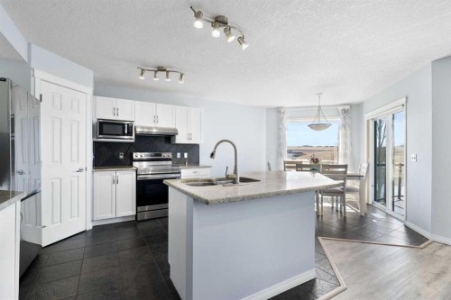 57 Bridlecrest Court Sw, Calgary, AB - Indoor Photo Showing Kitchen With Upgraded Kitchen
