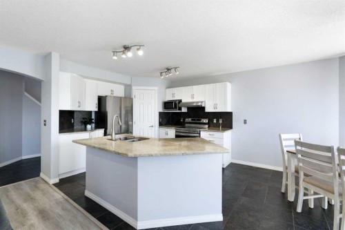 57 Bridlecrest Court Sw, Calgary, AB - Indoor Photo Showing Kitchen With Double Sink
