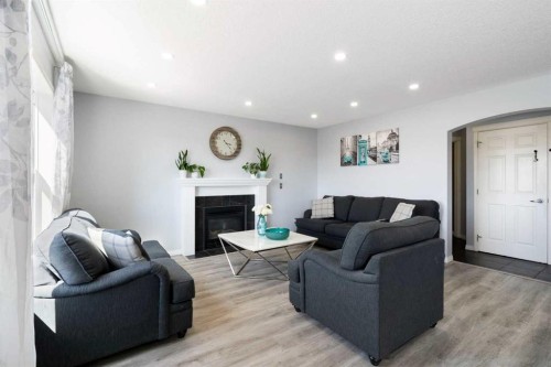57 Bridlecrest Court Sw, Calgary, AB - Indoor Photo Showing Living Room With Fireplace