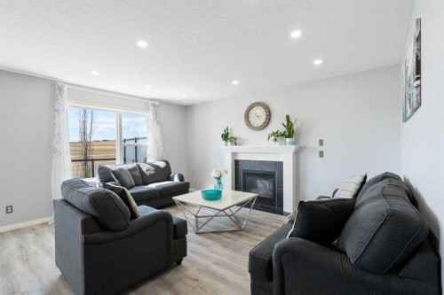 57 Bridlecrest Court Sw, Calgary, AB - Indoor Photo Showing Living Room With Fireplace