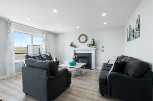 57 Bridlecrest Court Sw, Calgary, AB - Indoor Photo Showing Living Room With Fireplace